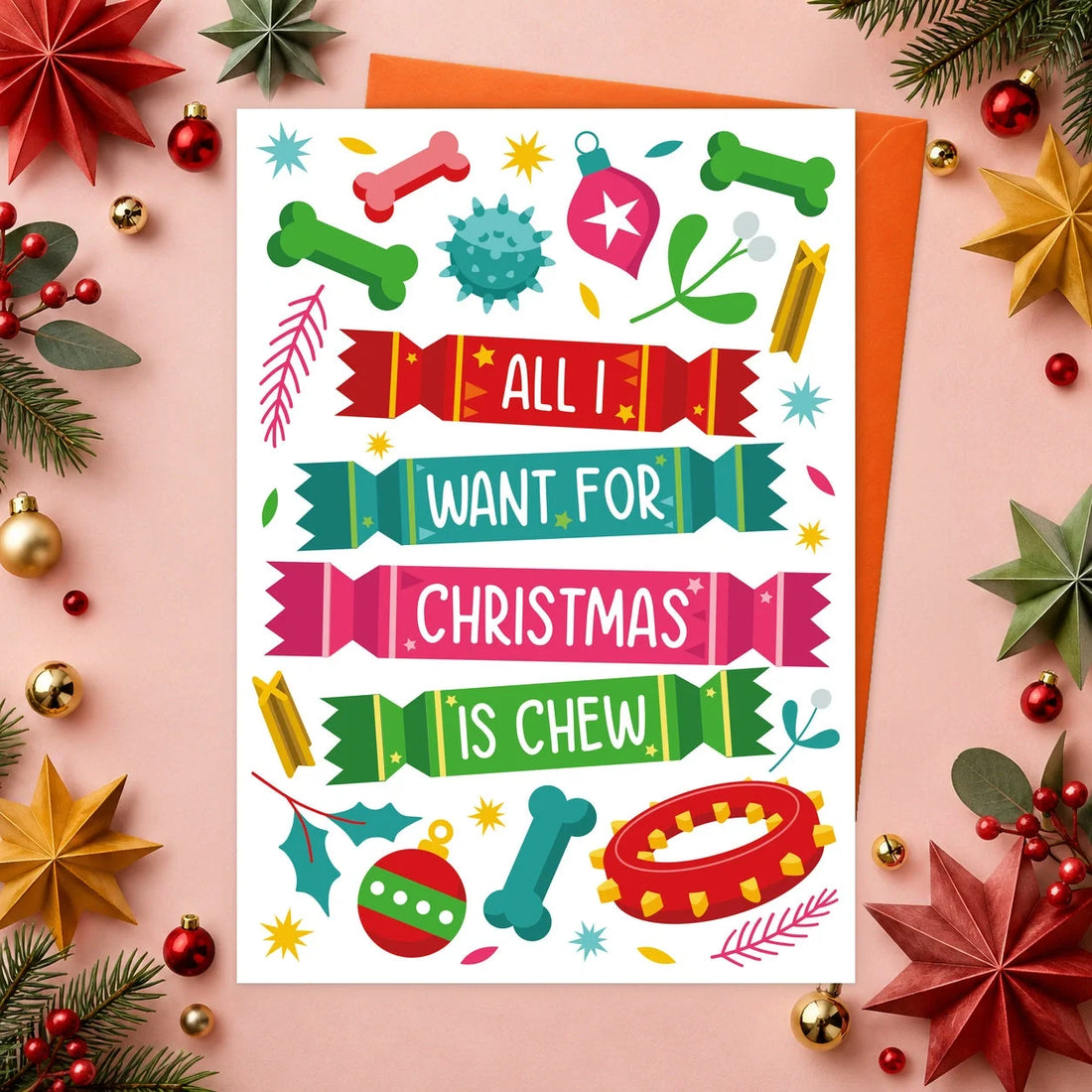 All I Want – Edible Dog Christmas Card, chicken flavour by Scoff Paper, shown with an orange envelope