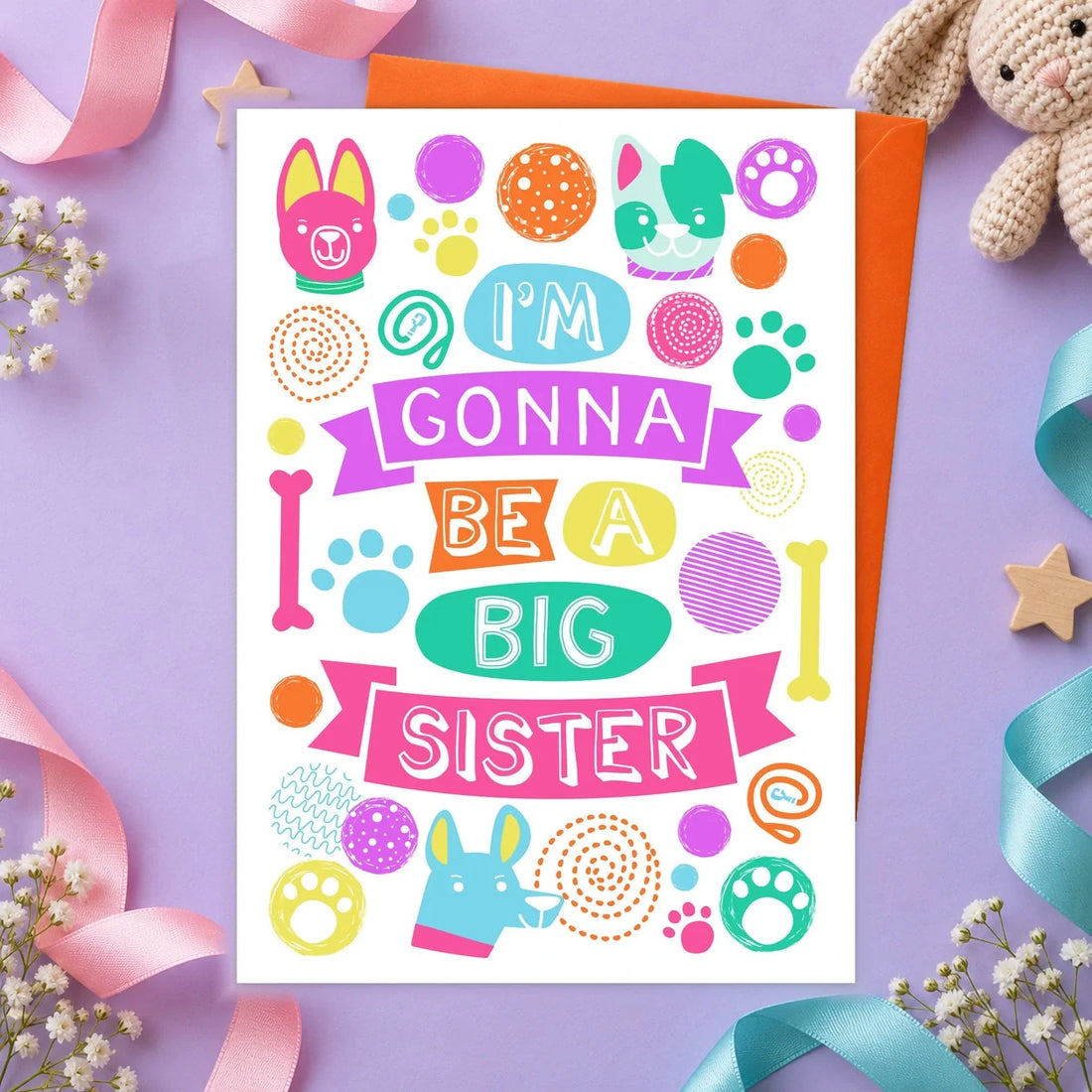 Big Sister – Edible Dog Card, chicken flavour by Scoff Paper, shown with an orange envelope