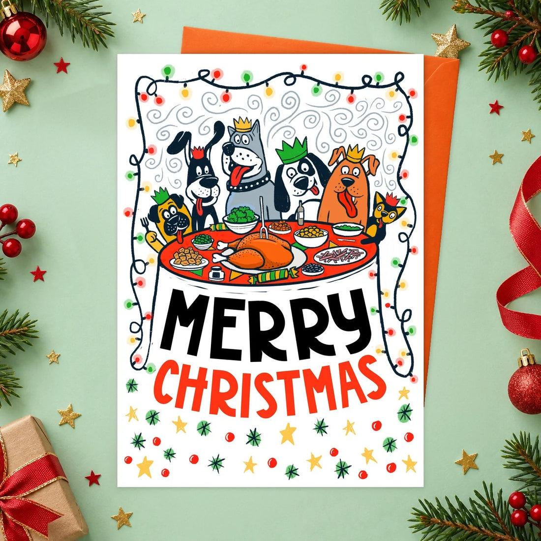 Christmas Dinner – Edible Dog Christmas Card, chicken flavour by Scoff Paper, shown with an orange envelope