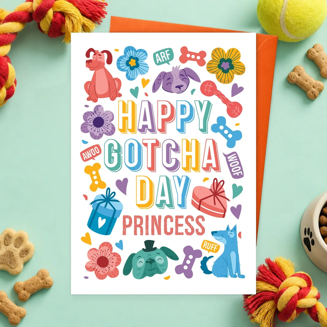 Gotcha Day – Personalised Edible Dog Card, bacon flavour by Scoff Paper, shown with an orange envelope