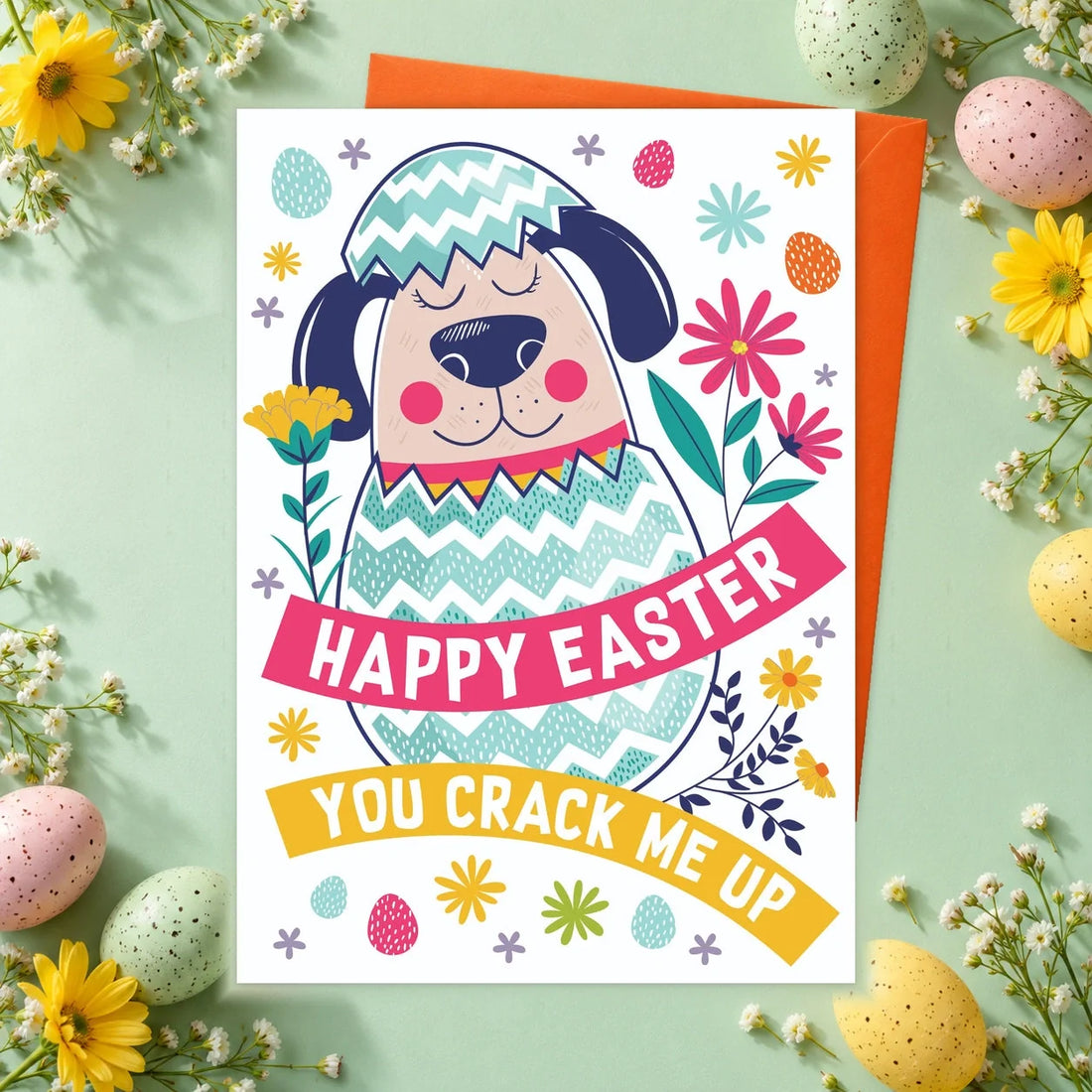 You Crack Me Up – Edible Dog Easter Card, chicken flavour by Scoff Paper, shown with an orange envelope