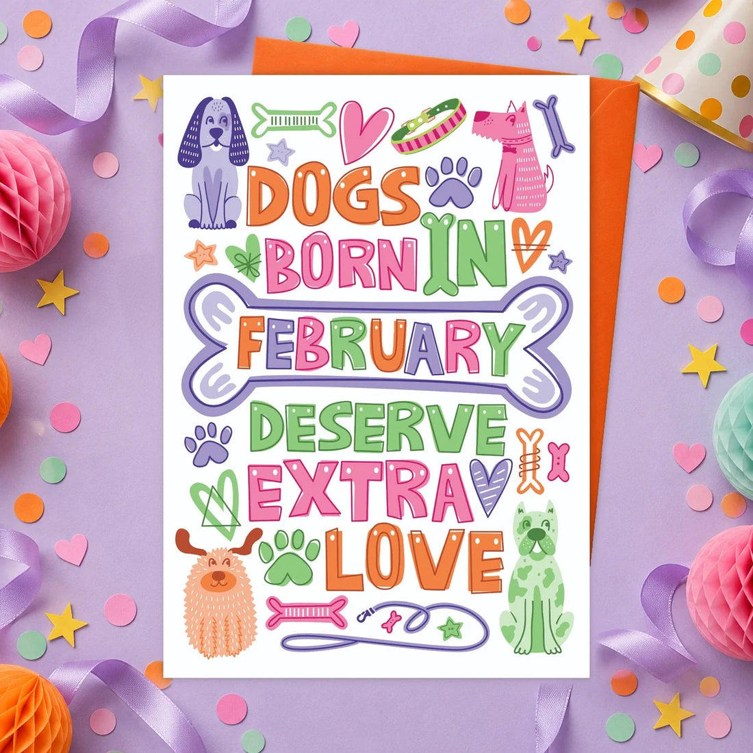 February Birthday – Edible Dog Birthday Card, bacon flavour by Scoff Paper, shown with an orange envelope