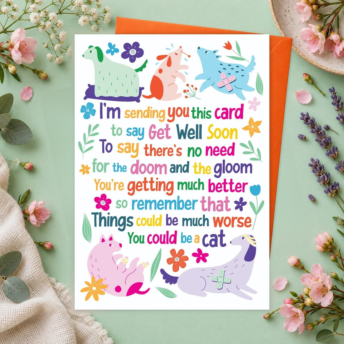 Get Well Poem – Edible Dog Get Well Soon Card, chicken flavour by Scoff Paper, shown with an orange envelope