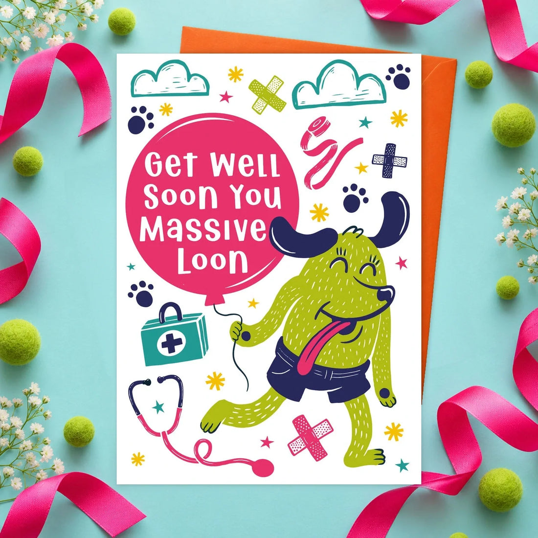 Get Well Loon – Edible Dog Get Well Soon Card, chicken flavour by Scoff Paper, shown with an orange envelope