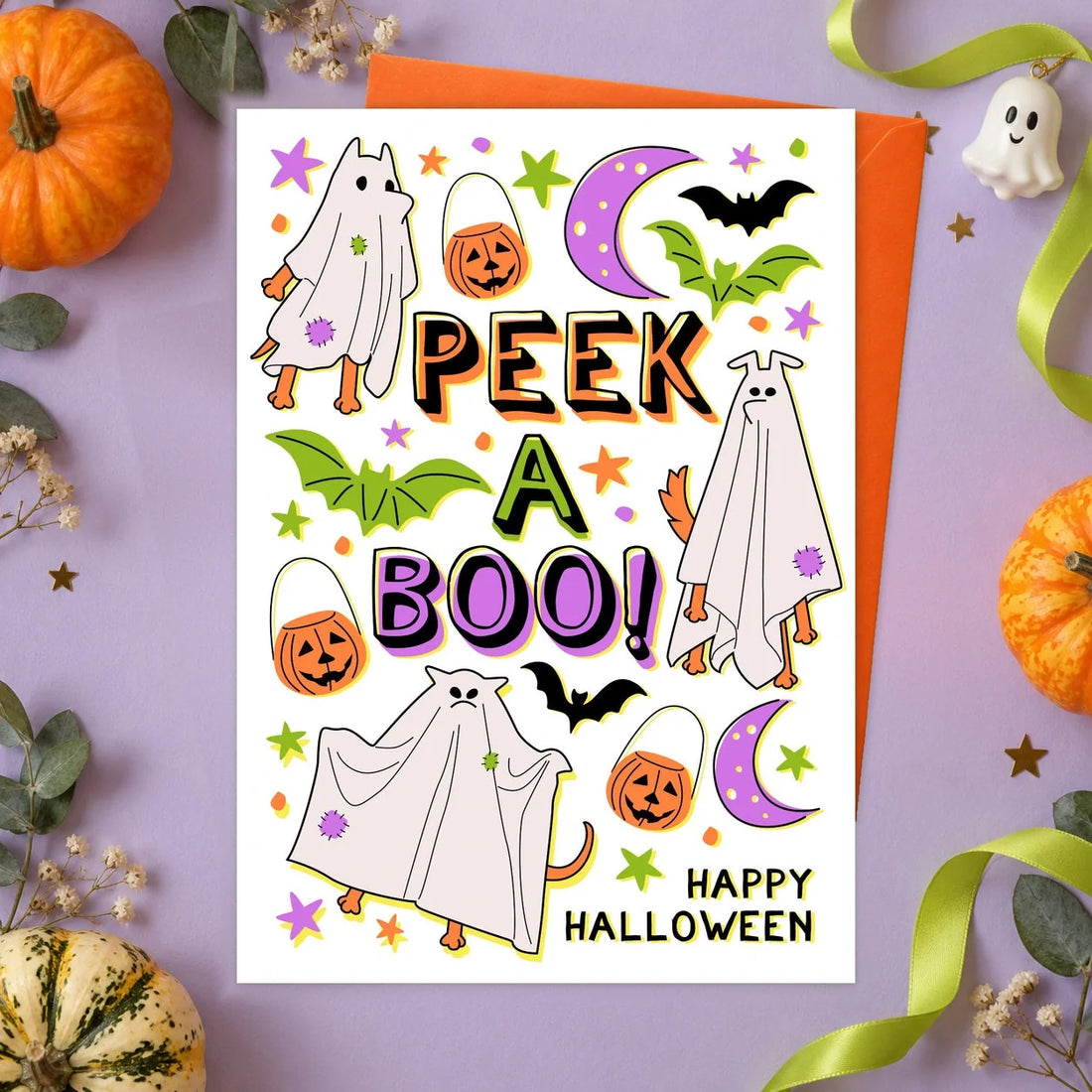 Halloween Peek a Boo – Edible Dog Halloween Card, chicken flavour by Scoff Paper, shown with an orange envelope