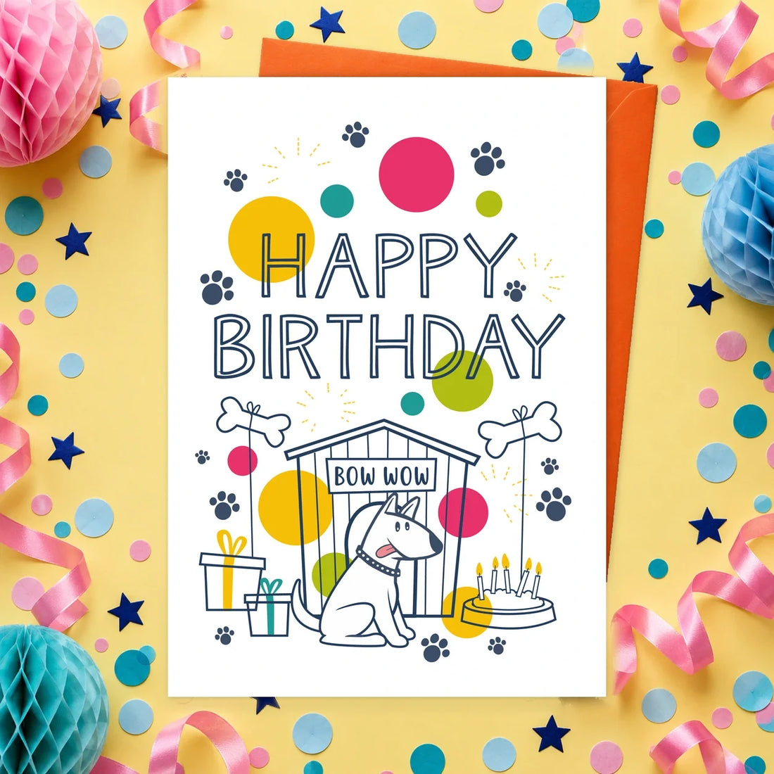 Happy Birthday Bow Wow – Edible Dog Birthday Card, chicken flavour by Scoff Paper, shown with an orange envelope
