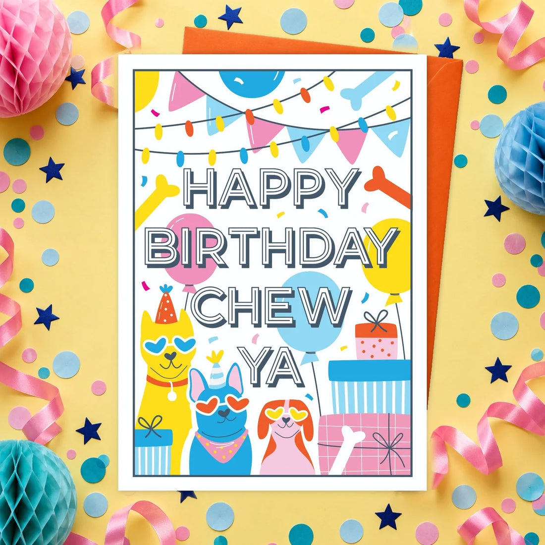 Happy Birthday Chew Ya – Edible Dog Birthday Card, chicken flavour by Scoff Paper, shown with an orange envelope