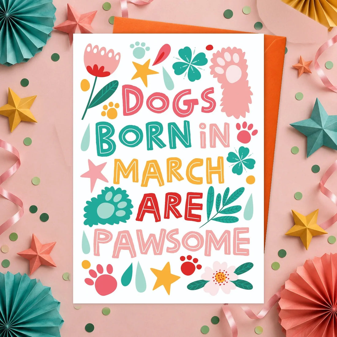 March Birthday – Edible Dog Birthday Card, bacon flavour by Scoff Paper, shown with an orange envelope