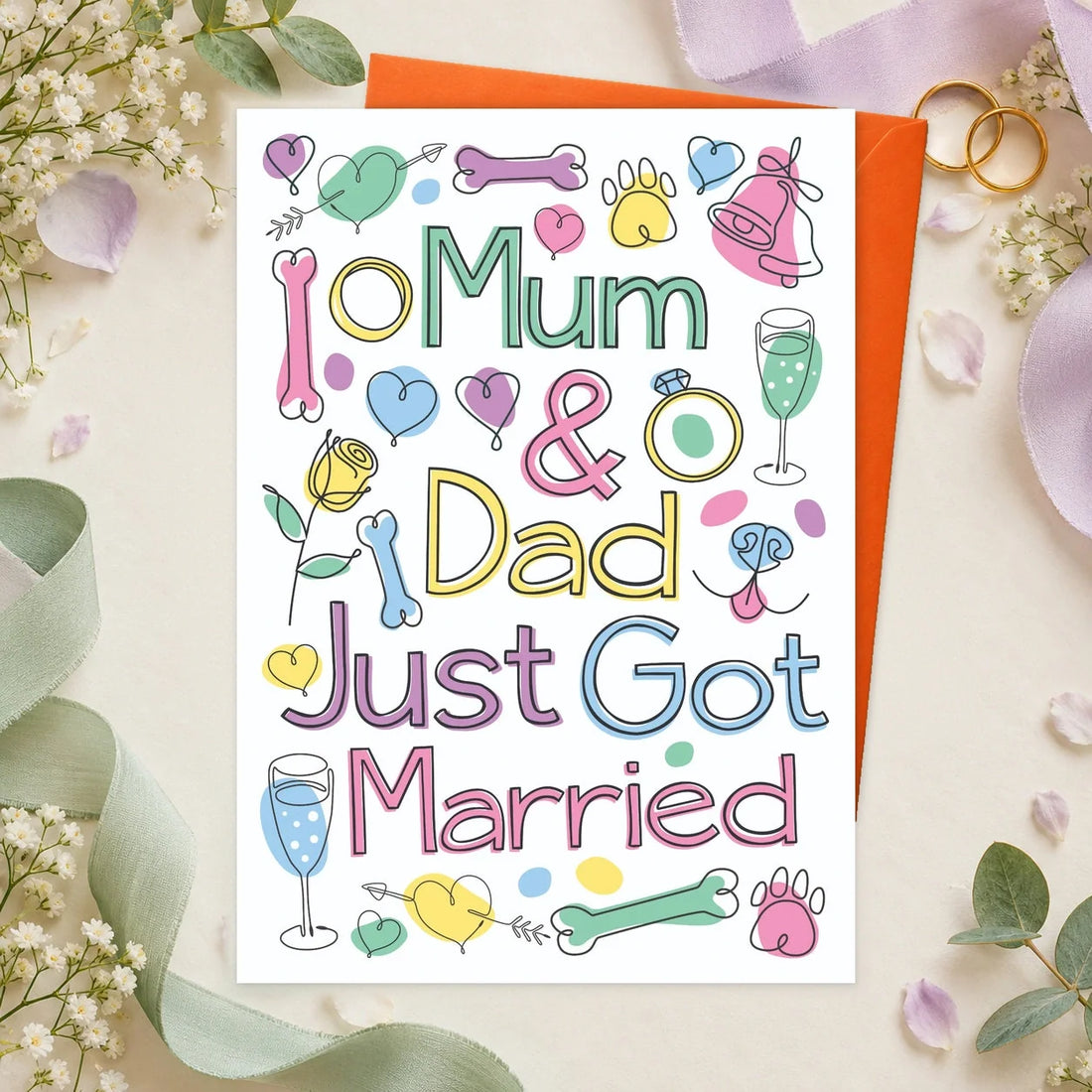Mum & Dad Wedding – Edible Dog Wedding Card, chicken flavour by Scoff Paper, shown with an orange envelope