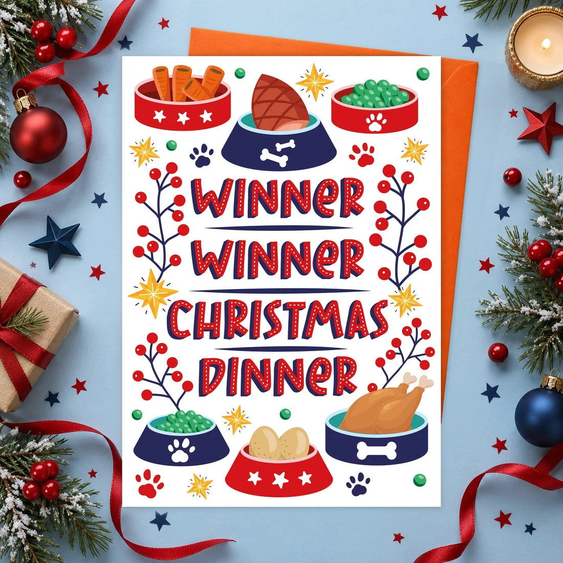 Winner Christmas – Edible Dog Christmas Card, chicken flavour by Scoff Paper, shown with an orange envelope